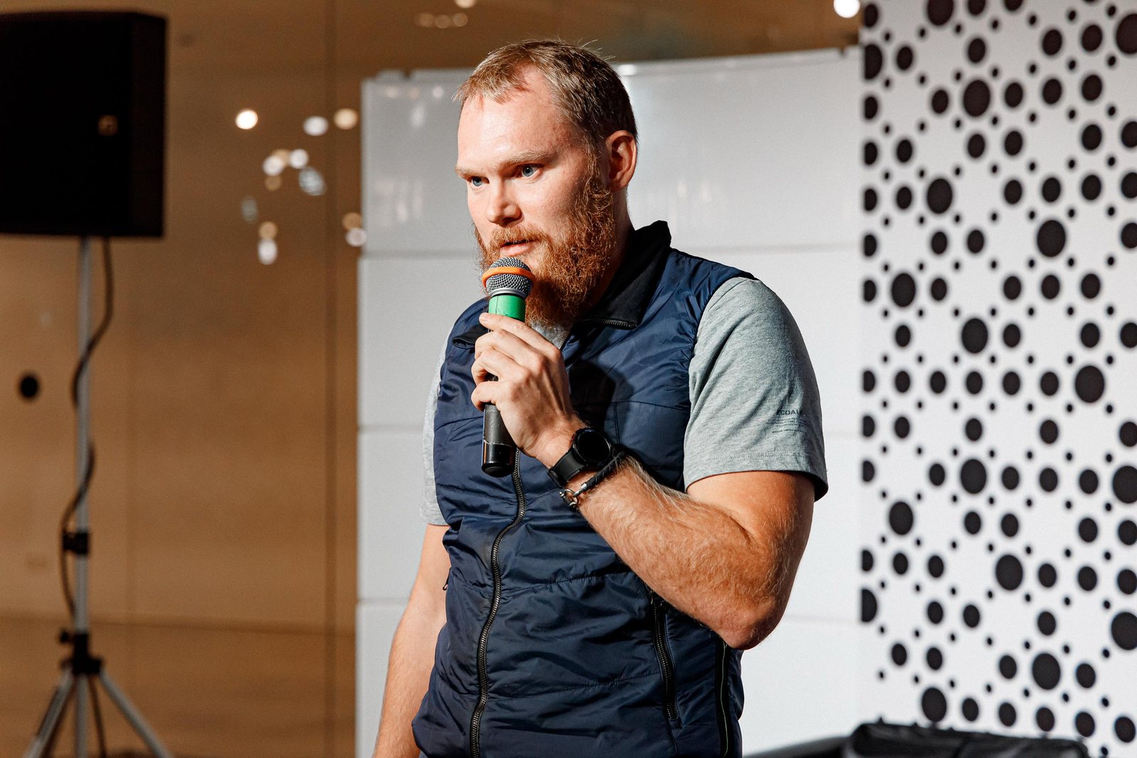 Ilia Sotonin speaking on stage, 2026